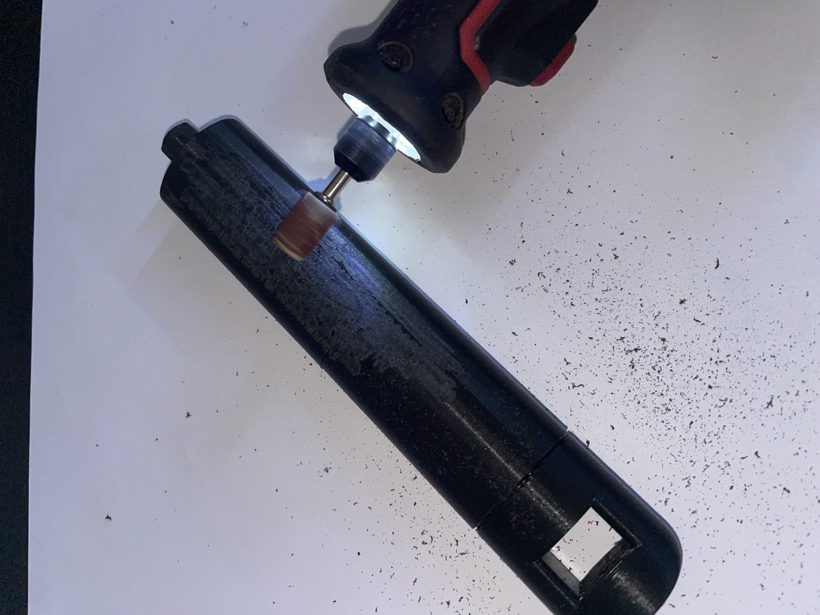 Hand-sanding a 3D-printed part to smooth its surface.